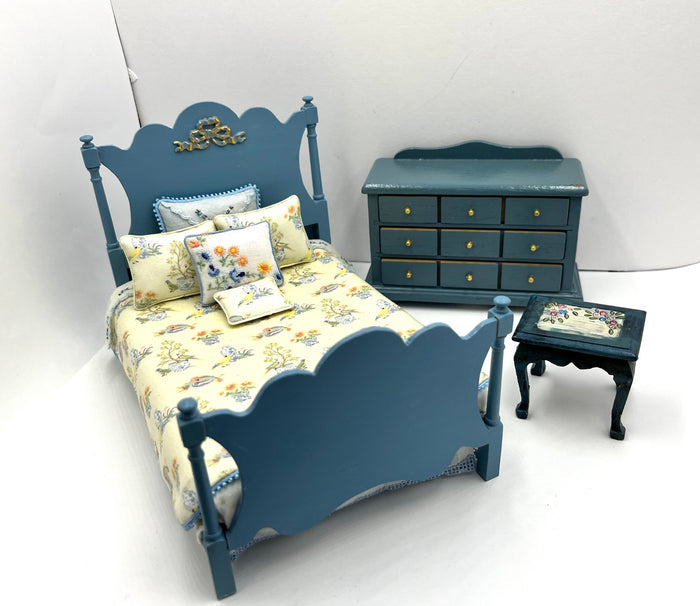 Blue Bedroom Set With Yellow Floral Patterned Bedspread