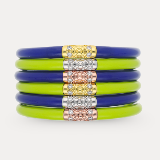 a stack of bracelets with gold and blue bracelets