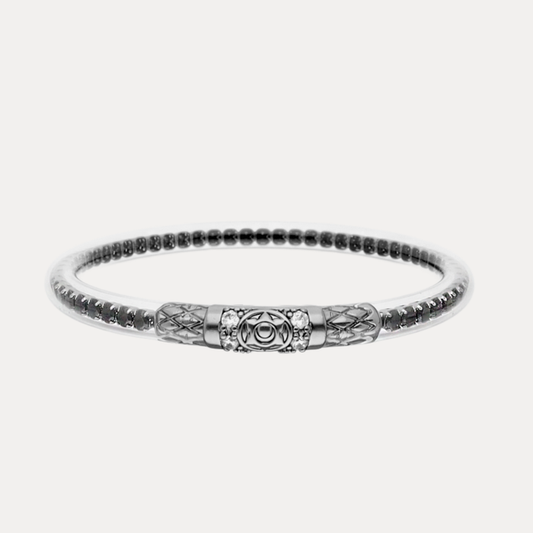 a silver bracelet with a design on it