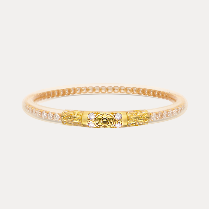 a gold and white bracelet with diamonds