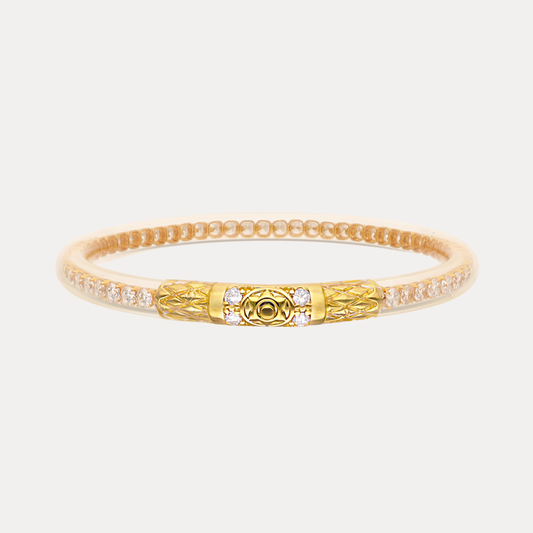a gold and white bracelet with diamonds