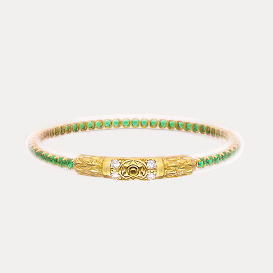 a gold and green bracelet