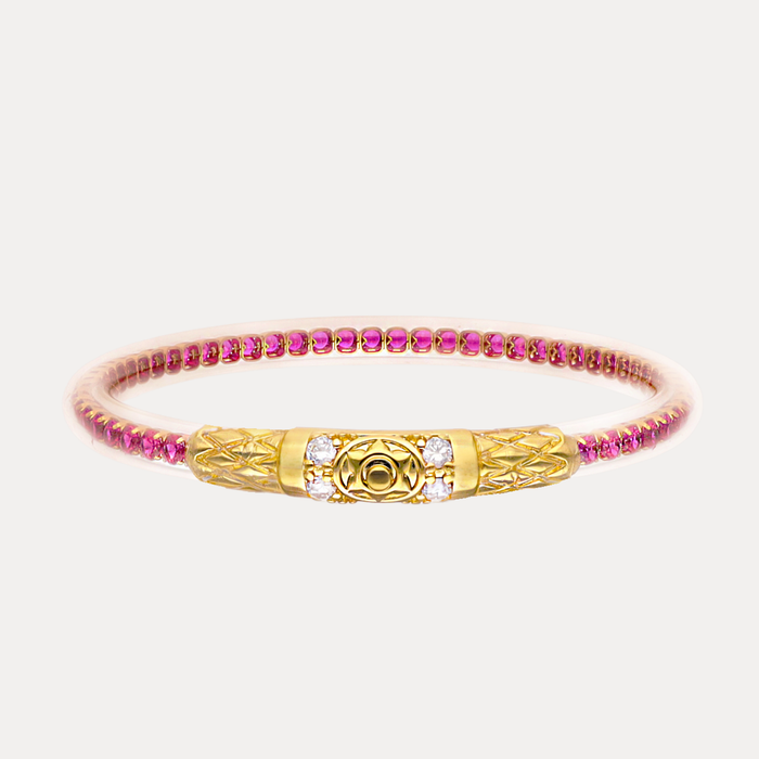 a gold and pink bracelet
