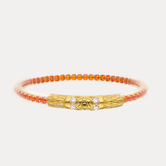a gold and orange bracelet