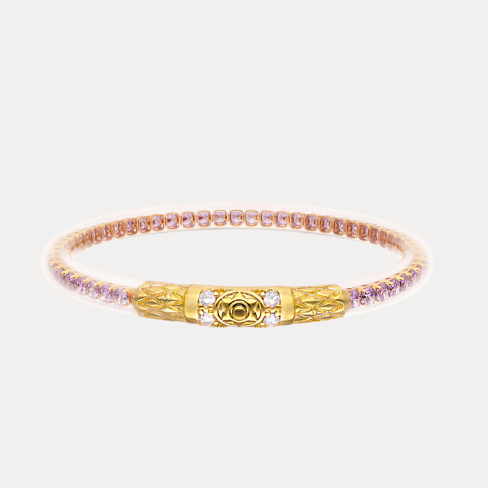 a gold and pink bracelet