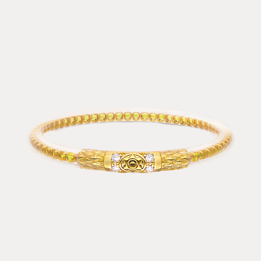 a gold bracelet with a gold band