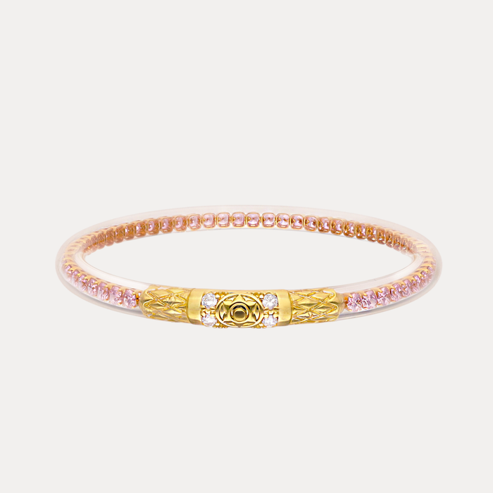 a gold and pink bracelet