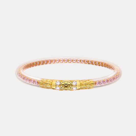 a gold and pink bracelet