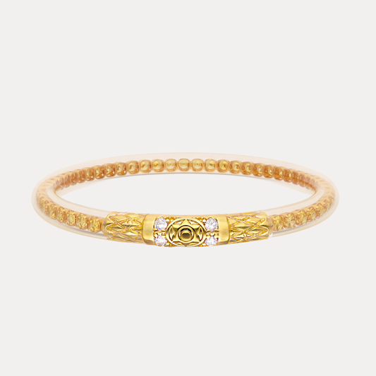 a gold bracelet with a gold band