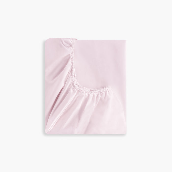 Solid Soft Pink fitted sheet on a white background