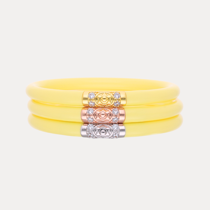 a yellow bracelet with gold and silver accents