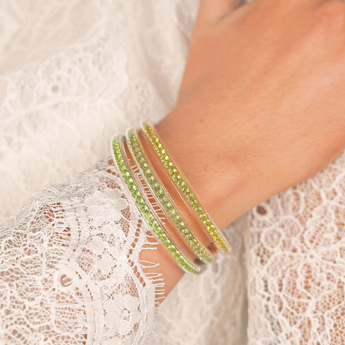 a hand wearing bracelets