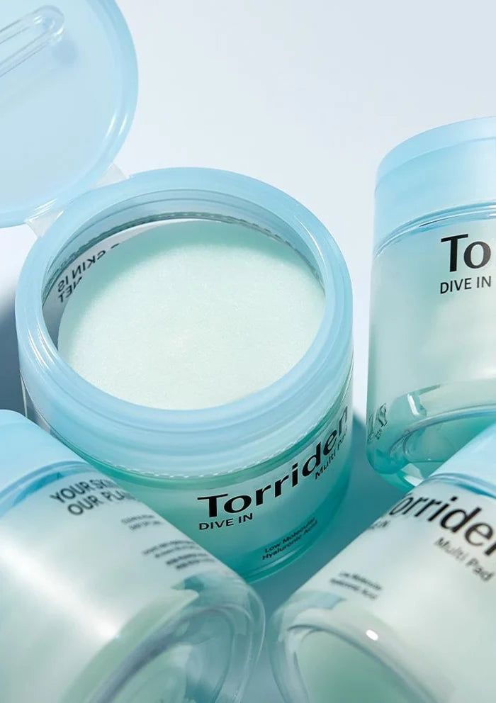 Torriden product with open jar and cap on a light blue background